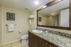 The ensuite bathroom has ample vanity space.