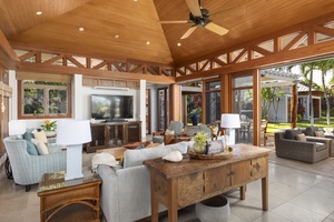 Bright and airy living area with expansive windows and sliding doors that fill the room with natural light.