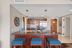 Start your day with fresh coffee at the kitchen island of Honua Kai Konea 204, complete with barstool seating.