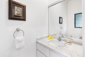 Half bathroom beside the entry to the home