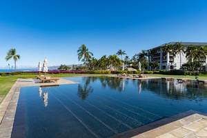 Enjoy exclusive access to this stunning oceanfront pool surrounded by lush palms.