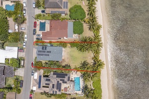 Bird’s-eye view of the beachfront property and its surrounding neighborhood.
