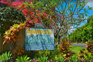 Lush landscaping and welcoming signage mark your arrival at Mauna Kai, Princeville's serene escape.*