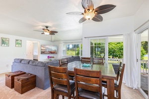 Dining area with ceiling fan and views, perfect for shared meals or game nights.