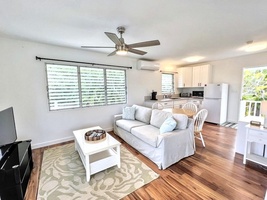 Unwind in the guest cottage sitting area, featuring cozy furnishings and new split air conditioning.