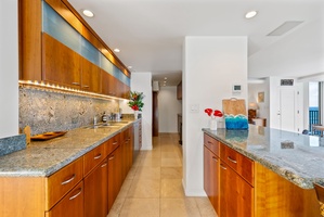 Modern kitchen with granite countertops, ample storage, and high-end appliances for all your culinary needs.