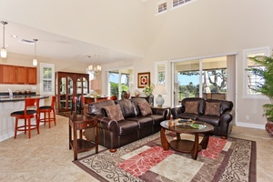 The expansive living and dining area with scenery from the lanai.