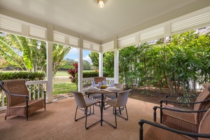 Your private covered terrace offers tropical garden views and perfect dining space surrounded by lush greenery.