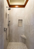 Guest Suite 2  enclosed shower view with elegant tilework and premium fixtures.