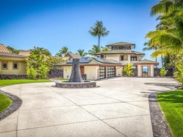 Grand entry to the property with wrap around driveway and water feature