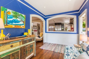 The vibrant main-level reading nook blends classic architecture with a touch of color—ideal for quiet moments.