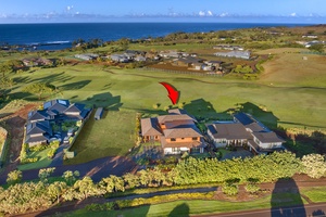 Aerial view showing the home’s oceanfront position along the fairway.