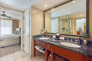 Clean, modern full bath at Hokulani 214 with dual vanities for convenience.