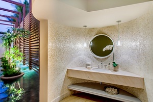 A modern powder room with a stylish vanity.