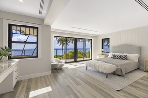 Primary bedroom retreat with king bed, private lanai, and ocean views that greet you each morning.