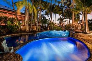 Paradise awaits with your own illuminated pool and spa surrounded by lush landscaping