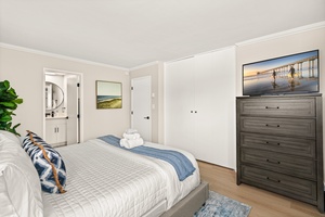 Ample storage and natural light in this cozy bedroom designed for extended stays.