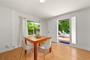 Picture yourself enjoying morning coffee at this charming dining table, then stepping through the glass doors to lounge by your private pool under swaying palms.