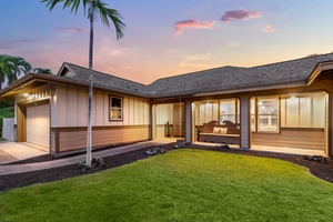 Cozy patio retreat framed by palms and sunset skies.