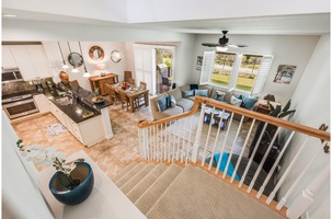 Open-plan living/dining area offers the ultimate in comfort and convenience, including a private lanai with gas grill, dining table and big comfy chairs