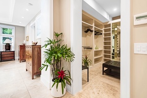 Lush plant accents in the luxe primary closet.