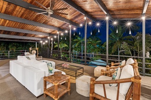 Your covered terrace offers plush seating and inspiring views, perfect for evening relaxation under warm lighting.