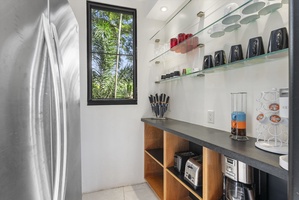 A stylish pantry space with open shelving, perfect for keeping essentials organized.