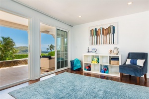 Downstairs ground and pool level sitting room with mini fridge and drink station.