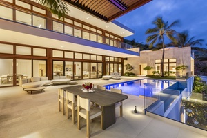 Twilight poolside elegance with stunning views and ample seating for evening gatherings.