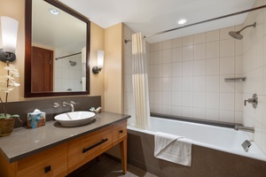 The second full bath features a deep soaking tub, shower combo, and resort-quality amenities.