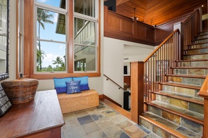 Stairs from the entry foyer to the lower level bonus “retreat room”