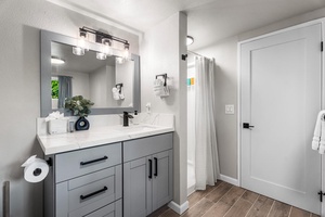Ensuite vanity with sleek finishes and plenty of counter space.