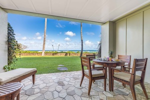 Spacious covered lanai with Pacific views and lush tropical surroundings.