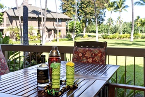 Sip tropical cocktails on your private balcony while soaking in lush garden views and swaying palms.