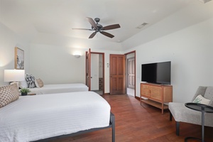 Reverse view of the fourth bedroom showcasing the private entrance and entrance to the full bath