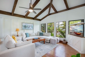 Comfort meets island elegance in this breezy living space with new furnishings and natural light.