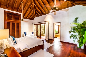 Bright and airy guest bedroom with a private garden view.