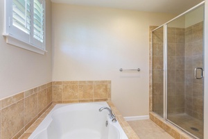 Soak in the tub and enjoy a spa-like retreat in this spacious bathroom.
