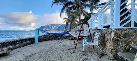 Enjoy sweeping views along the reef-fringed shoreline from the home’s private beach area, where sunrise hues, calm waters, and Hawaiʻi’s natural beauty define the everyday experience.