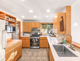 Whip up fresh coastal meals in the fully equipped kitchen, featuring wide counters and everything you need for effortless vacation cooking.