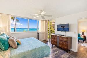 Step out to the lanai from Royal Kahana 308’s bedroom with king bed and flat-screen TV.