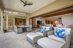 Elegant lounge seating and a gorgeous formal dining table with BBQ grill and prep area.