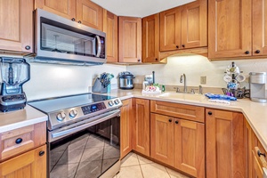 The kitchen at Kaanapali Shores 746 features modern appliances and a functional layout.