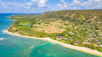 Aerial view of Velzyland’s golden coastline puts you steps from the surf and scenic shoreline trails.