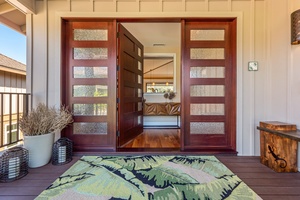 Grand entry doors open to a spacious foyer.