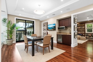 Stylish nook with a dinette and custom cabinetry and lanai access.