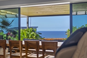 Breathtaking view from the dining area with seating for 8, overlooking the sparkling ocean.