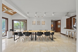 Stylish indoor dining area with seating for ten and easy access to the kitchen.