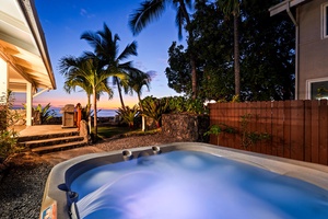 Relax and rejuvenate in the bubbling hot tub surrounded by swaying palms.