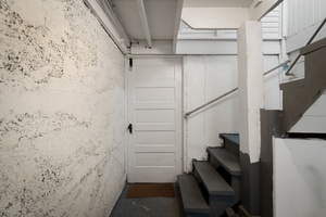 Enter through this practical interior stairwell connecting the home's living spaces.